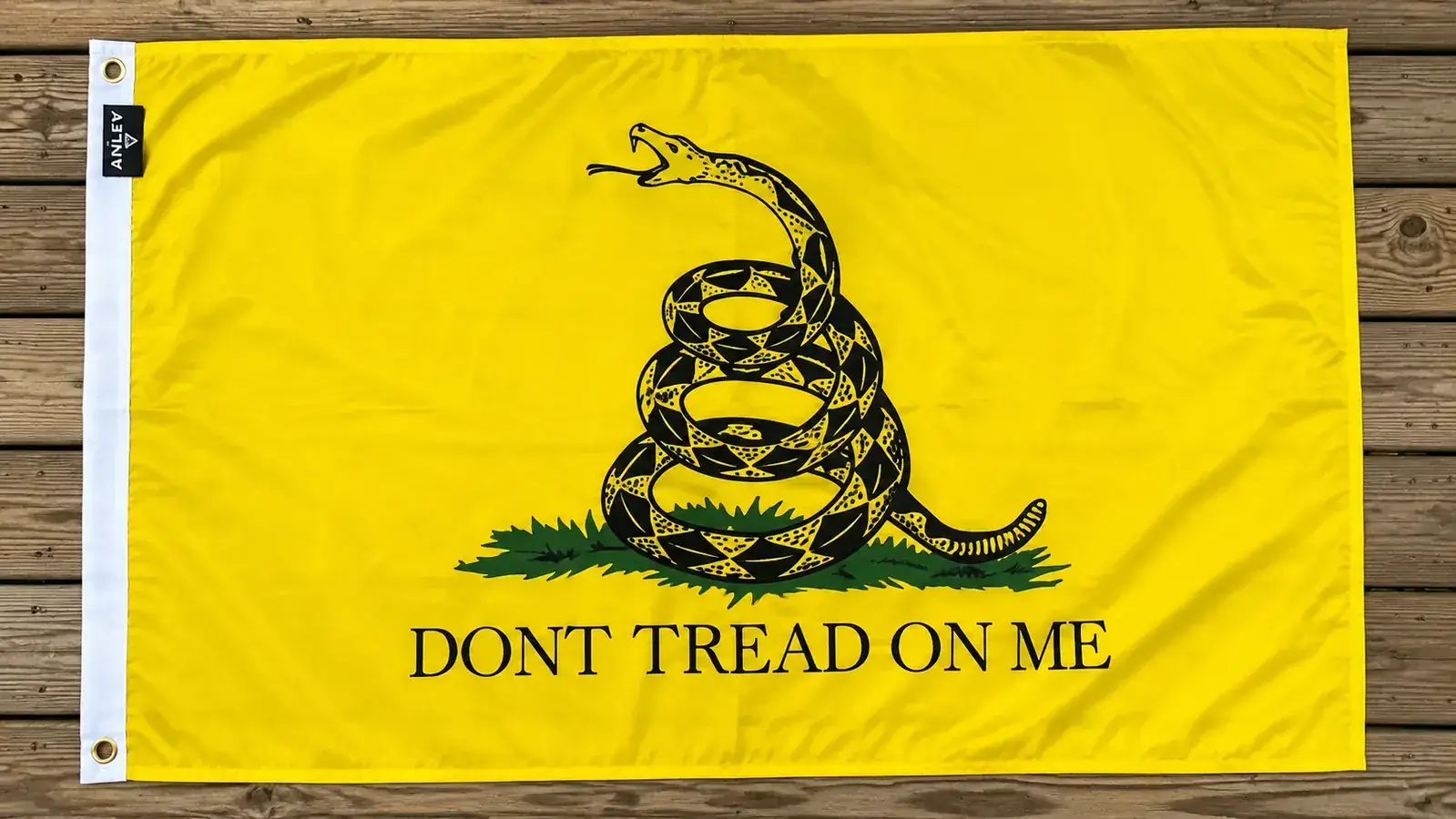 Close-up of the Anley DTOM flag canvas header and brass grommets showing the double-stitched edge