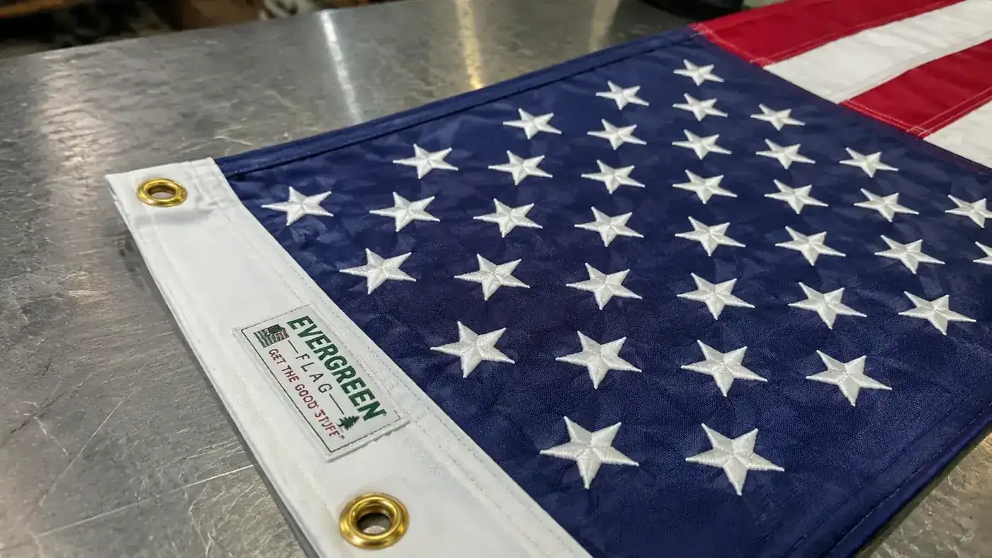 Close-up of embroidered stars on the Evergreen Flag American flag, showing tight stitching and vivid color